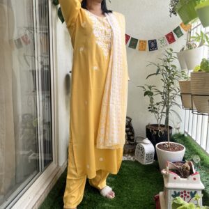 Sunshine Yellow Cotton Kurti Set Step into elegance with this beautiful sunshine yellow kurti set, crafted from soft, breathable cotton for all-day comfort. Adorned with delicate white embroidery on the yoke and scattered floral motifs, the set includes a matching pant and a soft cotton dupatta with subtle prints, adding a graceful charm to your look.