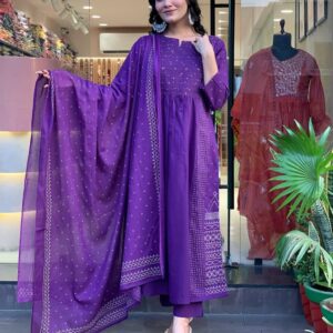Royal Purple Printed Kurti Set Make a statement with this stunning royal purple kurti set, crafted from soft, breathable cotton fabric. The kurta features intricate all-over print with delicate mirror-effect details, exuding traditional charm with a modern twist. It comes with a matching printed pant and a beautifully bordered cotton dupatta that drapes gracefully, adding richness to the ensemble.